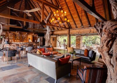 Kapama River Lodge River Bar lounge and fireplace